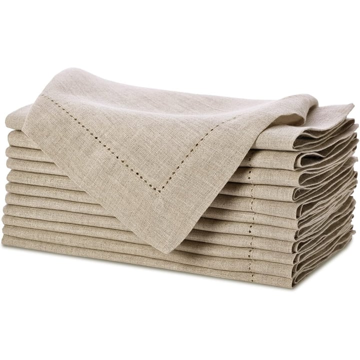 Stack of twelve natural linen napkins with a hemstitch edge